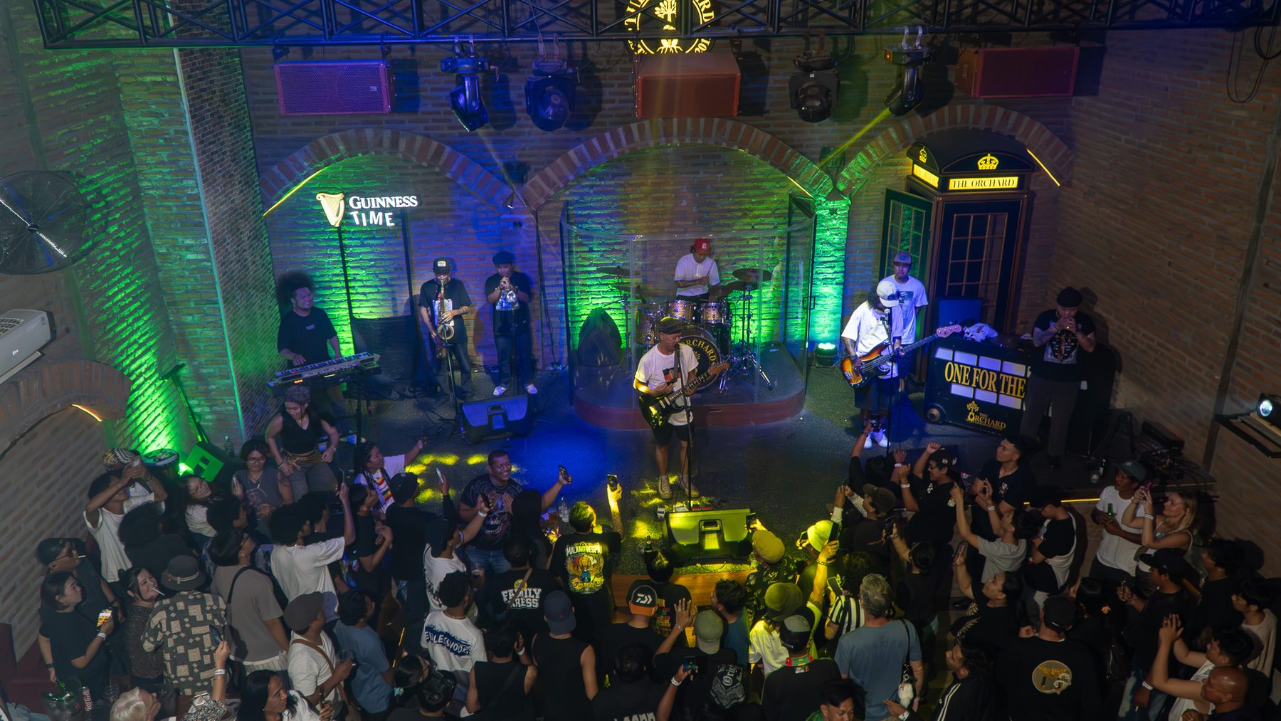 Aerial view of a live band playing to the crowd at The Orchard